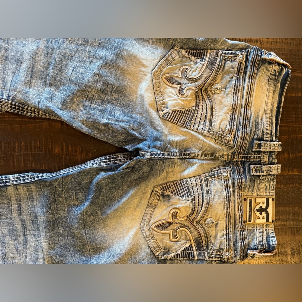 Rock Revival 34/32 Men's Blue Jeans with Embroidered Pockets. distressed
